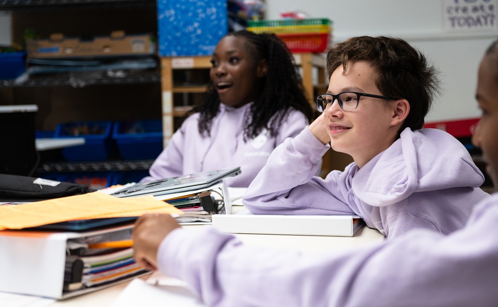 8th grade students at Christ Episcopal School smiling in class
