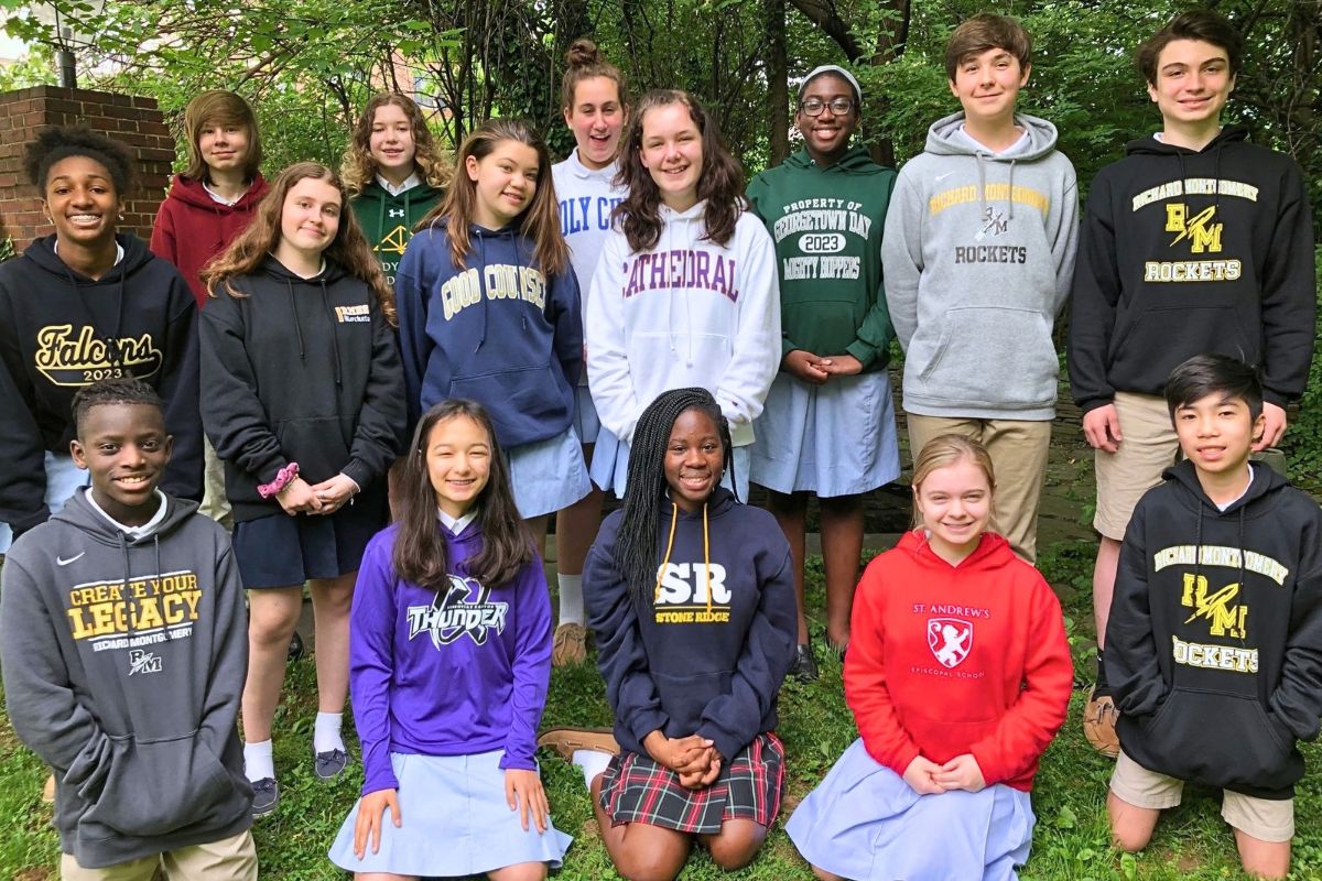 Christ Episcopal School 8th grade students pose for a photo in their high school sweatshirts